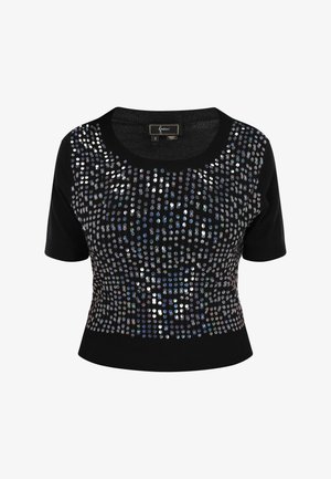 Juoda trumpomis rankovėmis megztinis su apvaliu iškirpimu, papuoštas sidabro ir švytinčiais blizgučiais, kurie ant priekinės dalies sukūrė tinklinį raštą.