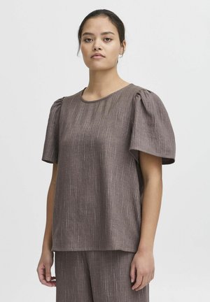 Brun kortärmad topp med texturerad yta, featuring puffärm och rund halsringning. Lättviktsmaterial med subtila ränder.
