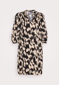 Robe mi-longue à imprimé animal abstrait noir et beige avec des manches longues bouffantes et un col en V.