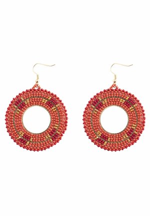 Round hoop earrings covered in small orange, red, and gold beads with gold hooks.