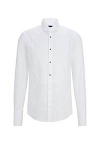 White long-sleeve shirt featuring a curved front panel, black buttons down the center, and a classic collar. Smooth fabric texture.