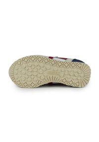 Suela de zapato con un patrón de textura y agarre; goma color crema con formas circulares y de diamante. Presenta el nombre de la marca "MUNICH" grabado.