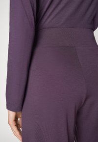 Yogasearcher RAVANA FLOWY PANTS - Donji dijelovi trenirke - topaze