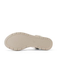 Suola di sandalo beige con motivo ondulato testurizzato, caratterizzata da scanalature profonde per una migliore aderenza. Forma arrotondata, leggera elevazione, taglia etichettata 37.