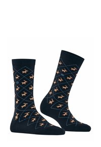 Chaussettes noires en coton avec un motif en losange. Caractéristiques de petits motifs de wapitis marron clair et de lignes diagonales bleues tout au long.