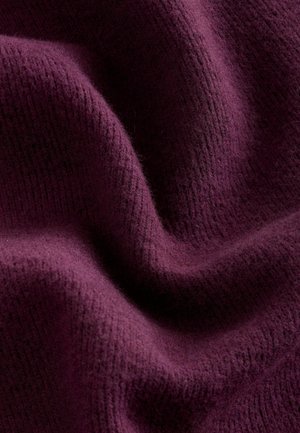 Purple woven fabric with a soft, textured surface. The material displays slight variations in knit density, enhancing its tactile quality.
