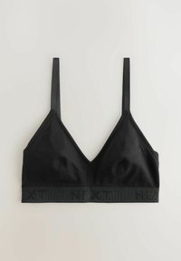 Bralette en tissu côtelé noir avec fines bretelles réglables et bande élastique imprimée "NEXT" le long du bord inférieur.