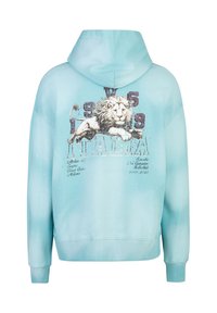 Helles blaues Hoodie mit einem Löwenmotiv, abgenutztem Text und Akzenten in Weiß und Grau. Weicher Stoff mit gerippten Bündchen und Saum.
