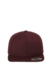 Murel snapback kübar, mis on valmistatud tekstuuriga kangast. Omab lapikut visorit, struktureeritud krooni ja ümarat silti esipaneelil.
