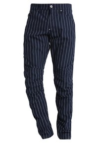 Mörkblå randiga byxor med slim fit, tillverkade av lättviktsmaterial. Funktioner inkluderar en knappstängning och sidofickor.