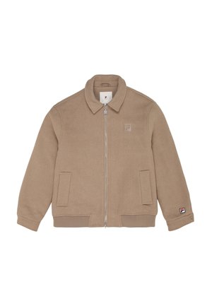 Vaaleanbeige vetoketjusaakku, joka on valmistettu pehmeästä kankaasta. Se on varustettu kauluksella, kahdella etutaskulla, ribbausvarusteisilla hihoilla sekä pienellä logolla rinnassa.