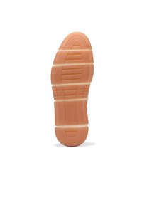Sohle eines Schuhs, hergestellt aus Gummimaterial, mit runder Form und strukturiertem Muster mit mehreren Rillen in einem hellen Pfirsichton.