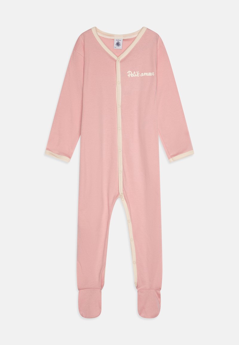 Pink cotton onesie with long sleeves, featuring cream accents along the collar and buttons. Text "Petit amour" on the front. Footed design.
