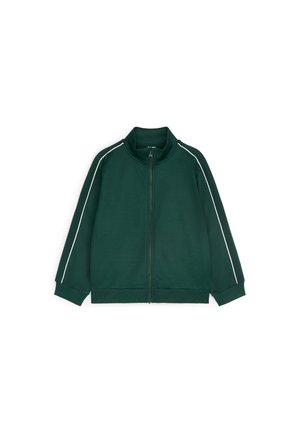 Veste zippée vert foncé avec col montant et passepoil blanc le long des manches, présentée sur un fond blanc.
