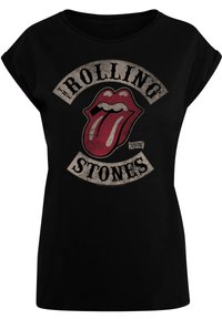 Zwarte katoenen t-shirt met een ronde halslijn. Heeft een grafisch ontwerp van een rode tong en de tekst "THE ROLLING STONES" in een verouderde stijl.