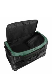 Zwarte wielensporttas met groene accenten, met een ritssluiting hoofdcompartiment en zijvak. Gladde textuur en stevige stofconstructie.