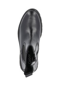 Black leather ankle boot featuring a smooth finish, elastic side panels, and a pull tab for ease of wear. Rounded toe design.