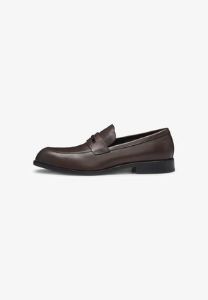 Brown leather loafers with a sleek design, rounded toe, and a decorative band. Features a smooth texture and a low black rubber sole.