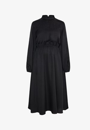 Must svart kleit pikkade varrukatega, volangiga dekoltee ja elastse vöökohaga. Omab tekstuuriga rinnaosa ja voolavat seelikut. Sile kangastekstuuri.