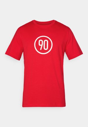 Red cotton t-shirt featuring a white circular graphic with the number "90" in the center. Classic crew neckline and short sleeves.