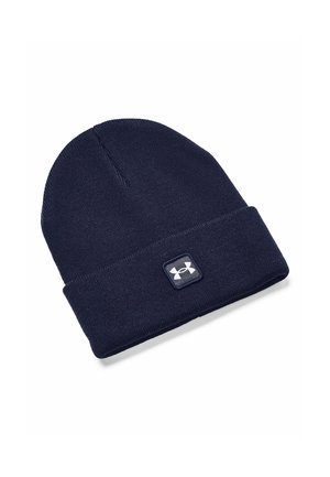 Navy blue knit beanie with a folded cuff, featuring a square logo patch on the front. Soft texture, ideal for cold weather.