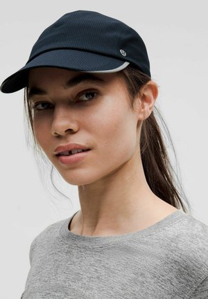 Navy cap with a structured design, featuring a contrasting white trim and a logo. Made of lightweight, textured fabric.