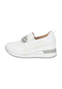 White sneaker with a mesh and synthetic upper, decorative silver embellishment, elastic band, and a cushioned wedge sole.