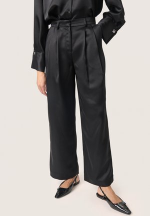 LIVA - Trousers - black