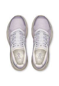 Purple running shoes with mesh upper, padded tongue, and textured sole. Features logo on insole and lacing system.