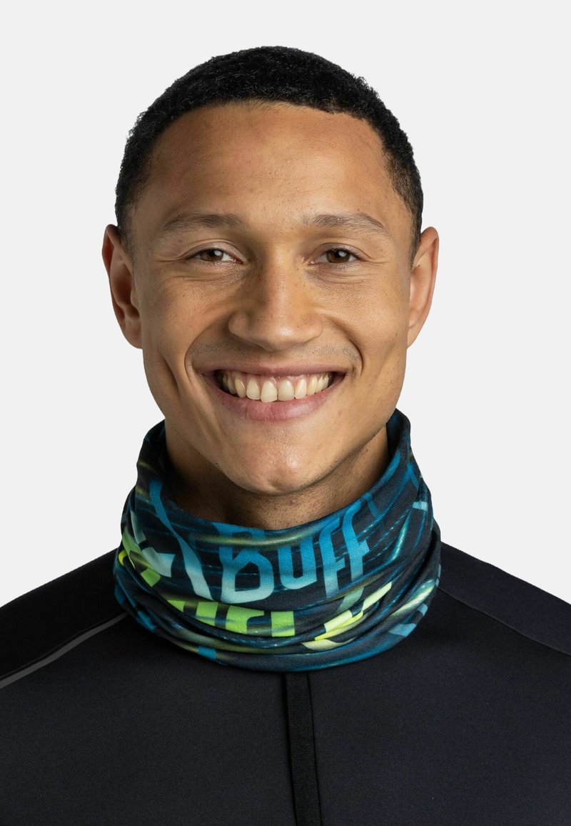 Multifunctional neck gaiter made of stretchy fabric, featuring a blue background with vibrant green and yellow abstract patterns.