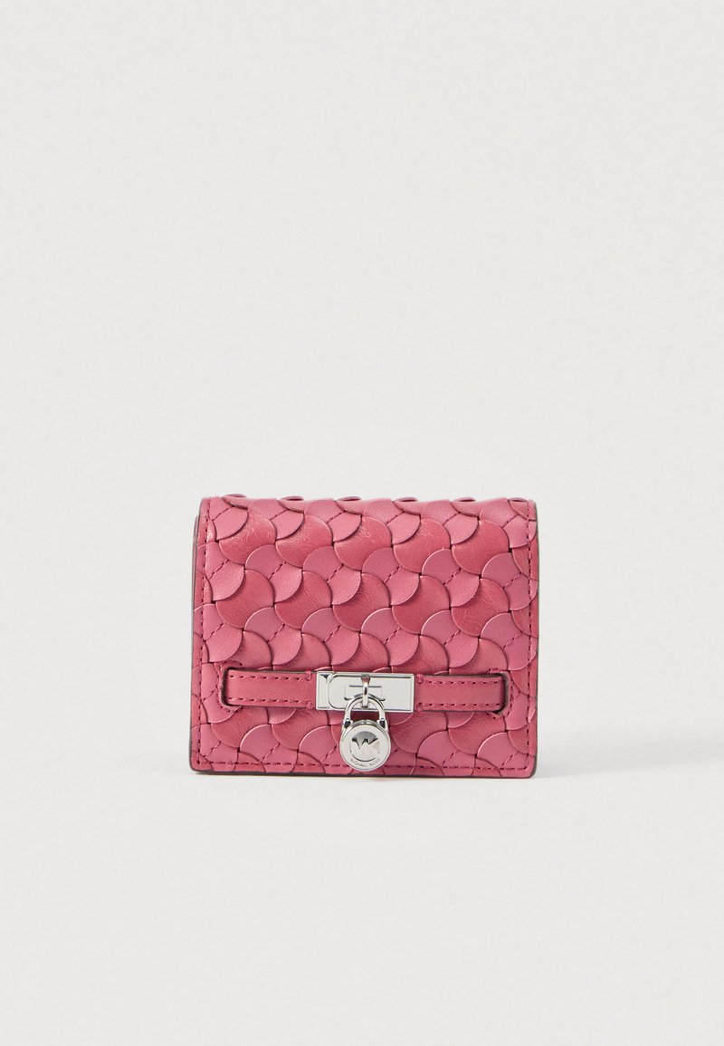 Pink leather wallet with a textured, scalloped pattern, rectangular shape, silver hardware, and a clasp closure.