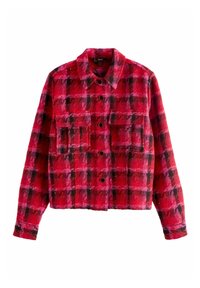 Punainen ruudullinen flanellitakki, jossa napitettava etuosa, kaulus, kaksi rintataskua ja pitkät hihat. Pehmeä tekstuuri, jossa on kontrastoivia mustia kuvioita.