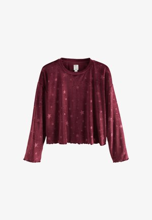Maglietta cropped a maniche lunghe in velluto a coste di colore rosso scuro con motivo a stelle e scollatura a girocollo rigata.