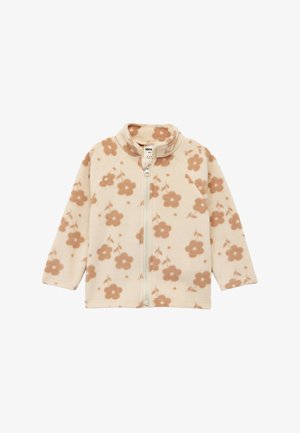 Veste en polaire crème avec un motif de fleurs beige clair, fermeture à glissière intégrale et col montant ; texture douce et manches raglan.