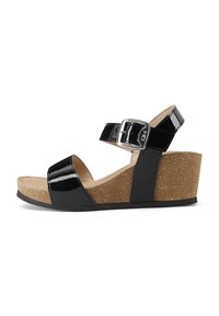 Sandali wedge neri in vernice con cinturino alla caviglia, fibbia regolabile, zeppa in sughero e dettagli neri testurizzati sui lati.