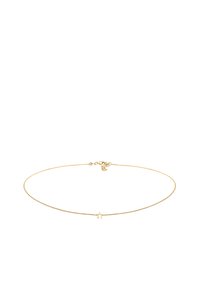 Gouden ketting met een dunne schakel en een klein stervormig hangertje. Fijn ontwerp, gladde textuur, verstelbare sluiting.