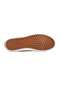 La suola della scarpa presenta un motivo a nido d'ape in gomma marrone con bordi bianchi. Il design include una leggera curvatura verso l'area della punta.