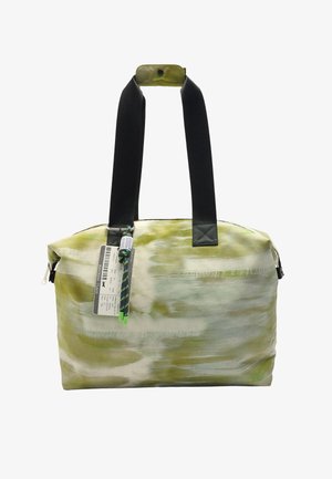 Zielona i kremowa torba na ramię w wzory, z czarnymi ramiączkami i zamknięciem na zamek. Zawiera metkę oraz dekoracyjny uchwyt z zielonym akcentem.