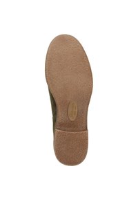 Semelle en cuir suédé vert avec une semelle en caoutchouc brun lisse. Présente un logo en relief et un motif texturé pour une meilleure adhérence.