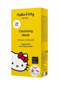 Boîte de masque nettoyant Hello Kitty, jaune vif avec un contour noir du personnage. Comprend un nœud rouge, un fond blanc et des détails sur le produit.