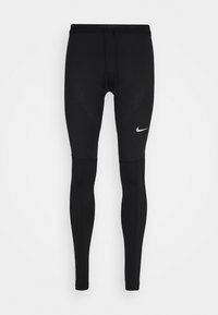 Schwarze Laufleggins aus dehnbarem Material, mit tailliertem Schnitt, flachen Nähten und einem kleinen weißen Nike-Logo auf dem Oberschenkel.