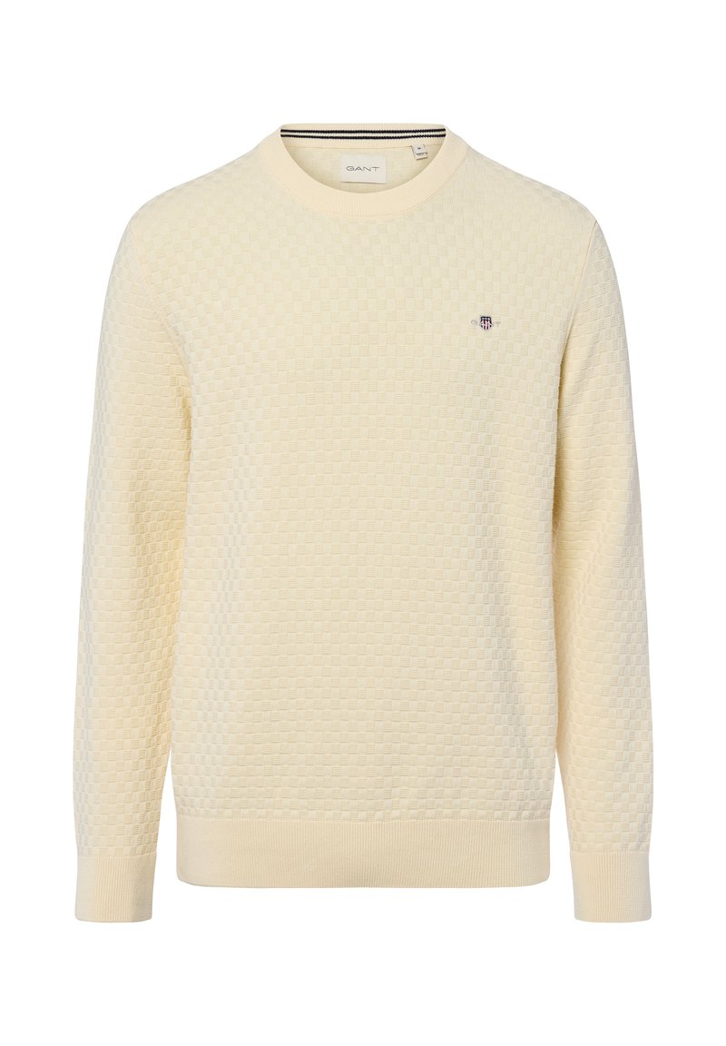 Cremfarbener Pullover mit strukturiertem Wabenmuster, Rundhals, gerippten Bündchen und Saum, mit einem kleinen gestickten Logo auf der Brust.