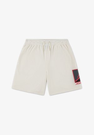 Shorts en mesh couleur crème avec taille élastique, cordon de serrage et poches latérales. Présentent un écusson logo noir et rouge sur la jambe gauche.