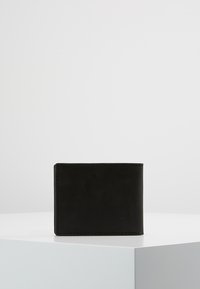 Black leather wallet with a smooth texture, rectangular shape, and minimalistic design. Stitching visible around the edges.