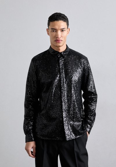 Black sequined shirt with a button-down collar, long sleeves, and a slim fit design. The fabric has a shiny, textured surface.