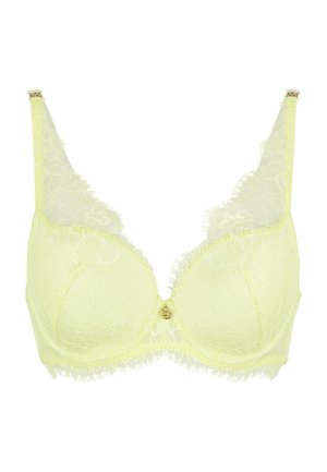 Light yellow lace bra featuring a floral pattern, underwire support, and adjustable straps. Notable frill accents around the cups.