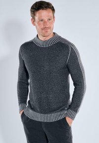 Dark gray knit sweater with a ribbed collar and cuffs, featuring contrasting light gray stripes along the shoulders. Soft texture.