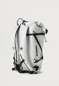 Σακίδιο από λευκό υλικό ripstop με μαύρες ιμάντες και σύρματα. Διαθέτει κλείσιμο με ρολό και λογότυπα στις πλευρές. Συμπαγής σχεδίαση.