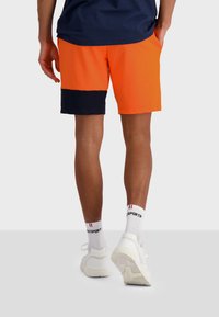 short le coq sportif homme jaune