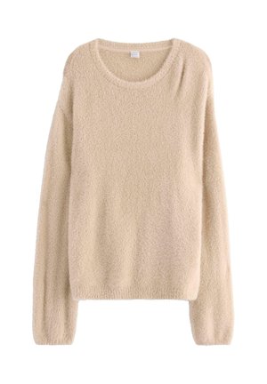 Beige tröja gjord av mjukt, texturerat tyg. Den har en rund halsringning, långa ärmar och en avslappnad passform.